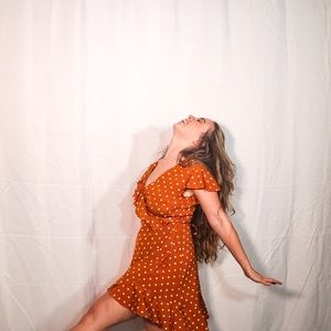 orange and white polka dot wrap dress